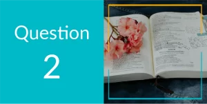 question 2. An open Bible with pink flowers on the left side 