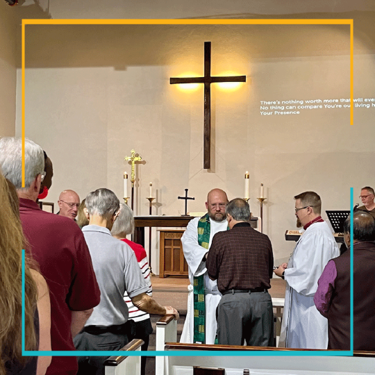 Group of people praying and worshipping together